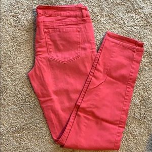 Pale red denim jeans